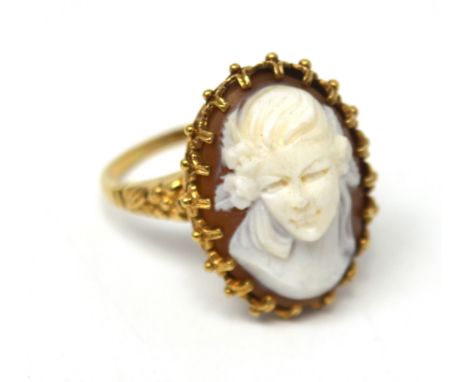 A 9ct yellow gold cameo ring with deep carved bust of a woman with flowers in her hair, size R 1/2, approx 6.6g.