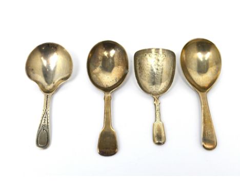 A George III hallmarked silver caddy spoon with bright-cut decoration to handle, Thomas Wallis II, London 1804, a further sim