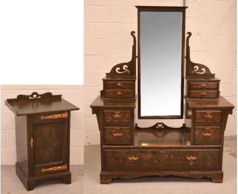 An early 20th century Arts and Crafts style stained pine two-door wardrobe, one mirrored door, one with stained glass panel, 