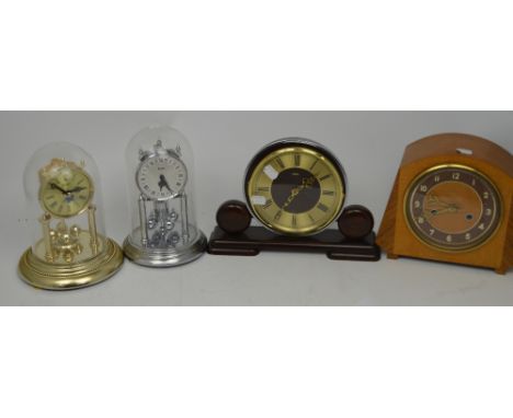 Four clocks to include a Kundo clock, a Metamec mantel clock and an Art Deco style mantel clock, wooden and silvered dial set