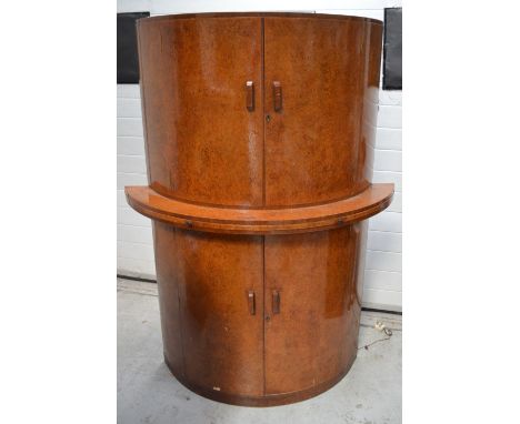 A mid-20th century walnut demi-lune shaped four-door cocktail cabinet, width 115cm.   CONDITION REPORT  Height 165cm, width 1