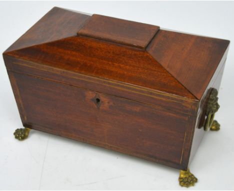 A 19th century mahogany sarcophagus tea caddy with original lead lining.