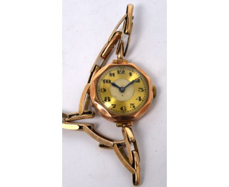 A vintage 9ct gold ladies' octagonal wristwatch, enamel and gilded dial set with Arabic numerals, on an expandable yellow met