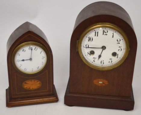 An early 20th century mahogany-cased Cathedral shape inlaid mantel clock, enamel dial set with Arabic numerals and a mid-20th