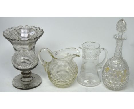 A small quantity of cut glass and crystal to include a decanter, two water jugs and a cut glass footed waisted vase (4).