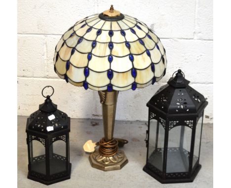 A Tiffany-style table lamp and two modern candle holders in the form of lanterns (3).