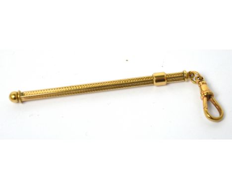 A 9ct yellow gold engine-turned decorated swizzle stick on suspension clip, approx 7.6g.