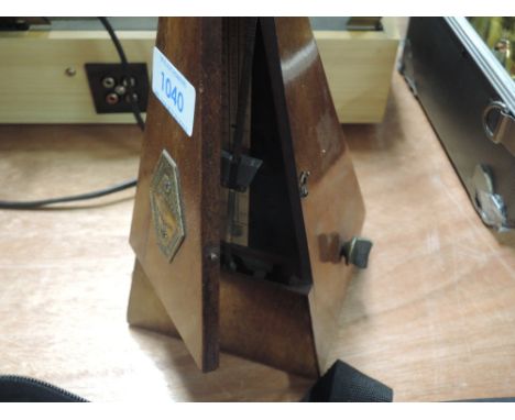 A traditional mahogany cased metronome, labelled Maelzel France