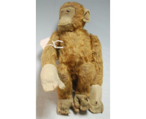 An early 20th century Steiff somersaulting chimpanzee, having jointed mohair body, length 27cm 