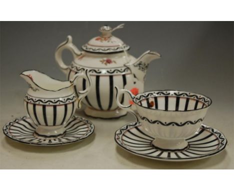 An early 20th century Coalport tea-for-two service, on black and white ground with central floral decoration  Condition Repor