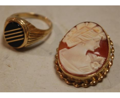 A carved shell cameo pendant brooch in 9ct gold mount, on 9ct flat curblink neck chain; and a 9ct gold black enamel gents sig