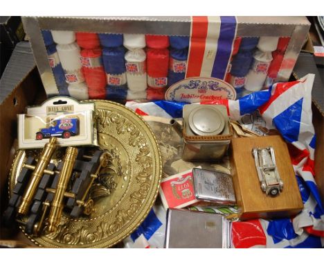 A box of miscellaneous items to include; commemorative Queens Silver Jubilee playing cards, pair of modern model cannons etc 