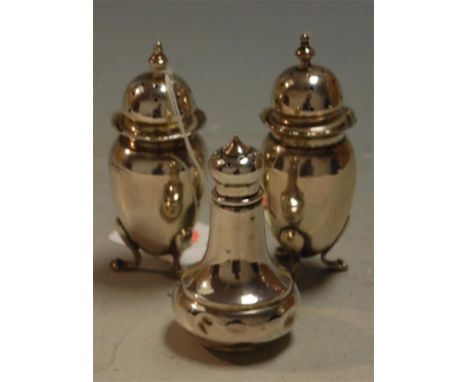 A pair of early 20th century silver pepperettes, maker John Round, London assays, together with one other silver pepperette (