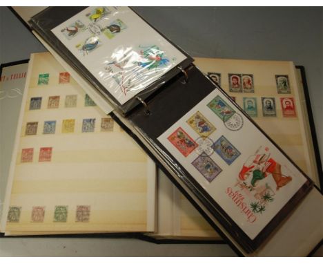 A folder of assorted 1980s first day covers; together with an album of stamps, mostly being French examples 