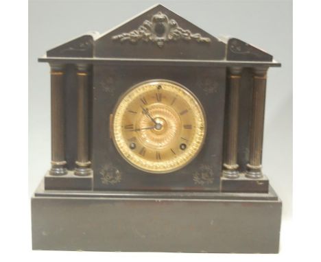An Edwardian black slate mantel clock of architectural form, having a brass dial with Roman numerals, and eight day cylinder 