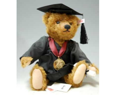 A modern Steiff Bear of the Year 2011 collectors bear with certificate, having button in ear; a Britains painted lead figure 