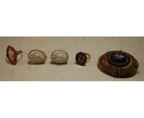 A yellow metal carved shell cameo ring; pair of pinchbeck carved shell cameo ear pendants; 19th century yellow metal mourning