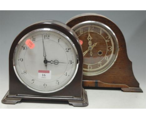 An Art Deco oak cased mantel clock; together with another bakelite cased example (2)