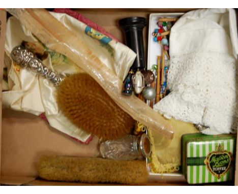 A box of miscellaneous items to include; late Victorian silver backed brushes, hat-pins, lace bobbins etc 
