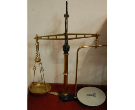 A pair of large Victorian brass and iron beam scales by WT Avery Ltd of Birmingham, the ceramic plate bearing a device for Jo
