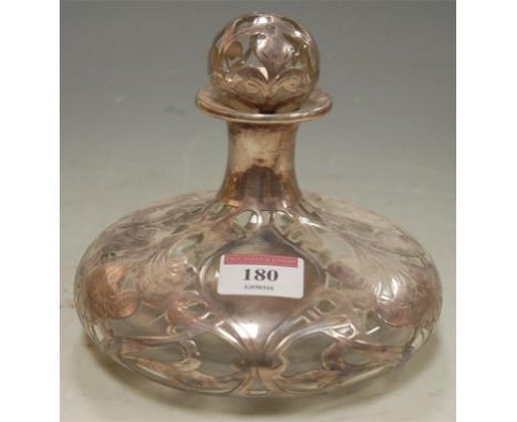 A circa 1900 American glass and white metal overlaid decanter and stopper, of squat circular form (stopper a/f)