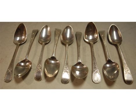 Nine George III silver teaspoons each with bright cut decoration, gross weight 3.6oz