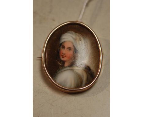 A continental painted porcelain portrait miniature in 9ct gold pendant brooch mount