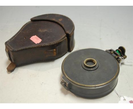 An early 20th century brass cased compass, stamped R W Starkey, maker Troughton & Sims of London, in original stitched leathe