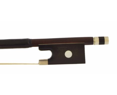 German silver mounted violin bow, unstamped, the stick round, the ebony frog inlaid with pearl eyes and the ebony adjuster wi