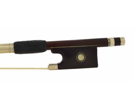 German silver mounted violin bow stamped Dodd, the stick round, the ebony frog inlaid with silver rings enclosing pearl eyes 