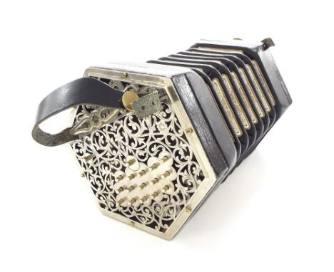 Shakespeare Anglo concertina, with thirty-three metal buttons on engraved pierced metal ends, six-fold bellows *In playing or