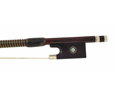 English silver mounted violin bow by and stamped John Clutterbuck, the stick round, the ebony frog inlaid with silver rings e