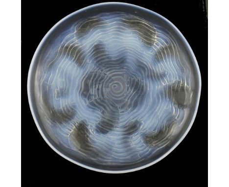Rene Lalique, a Dauphins opalescent glass plate, model 423, designed circa 1932, polished and frosted with blue staining, etc