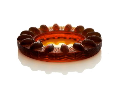 Rene Lalique, a Tabago butterscotch amber glass ashtray, model 295, designed circa 1928, polished and frosted, incised mark R