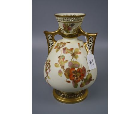 A Royal Worcester vase of baluster form, design number 1079, 1885 date code, pierced collar and twin handles, florally decora