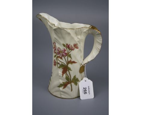 A Royal Worcester leaf moulded jug, florally decorated on an ivory and gilt ground, green printed mark, 18cm, 1891