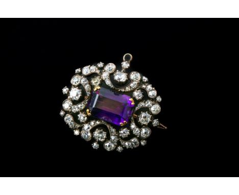 A late Victorian amethyst and diamond brooch, the rectangular step-cut amethyst within rose and mixed old cut openwork diamon