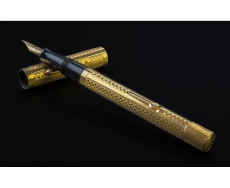 An American Waterman's Ideal 554 gold fountain pen, the engine-turned body signed Waterman's and marked '14k', pull-off cover