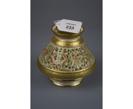 A late 19th century Royal Worcester reticulated posy vase of conical form, florally pastel decorated on an ivory and gilt gro