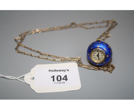 A silver and enamel pendant ball watch, the spherical two part guilloche enamel case with cream band and foliate and fleur de
