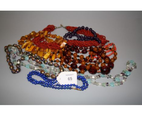 A lapis lazuli bead necklace, an enamelled bead necklace, an amethyst bead necklace and six further beaded necklaces