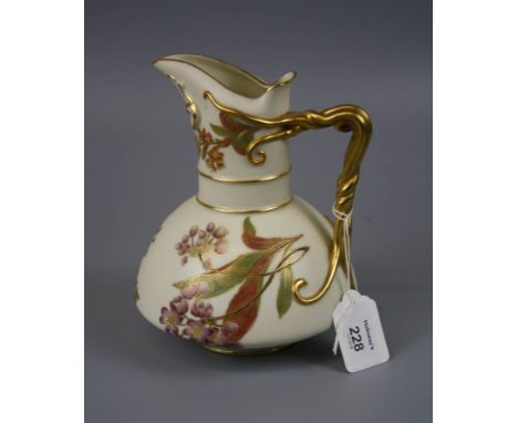 A Royal Worcester jug of baluster form with entwined tendril handle on a florally decorated ivory and gilt ground, design num