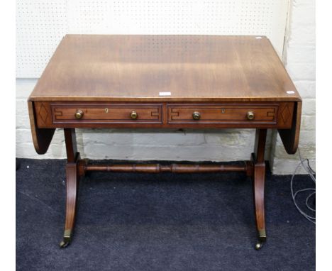 A George III zebrano banded and satin wood and ebony strung mahogany sofa table, fitted two frieze drawers, raised on sabre s