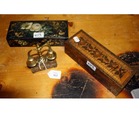 A pair of swinging brass horse bells, on a Tonbridge ware plinth, a Tonbridge ware cribbage box, a set of dominoes and a blac