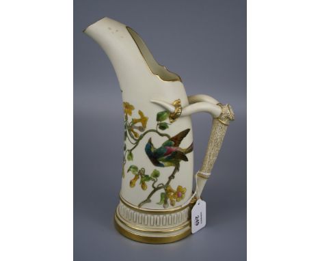 A Royal Worcester ice jug, design number 1116, with tusk handle, decorated in coloured enamel with an exotic bird and yellow 