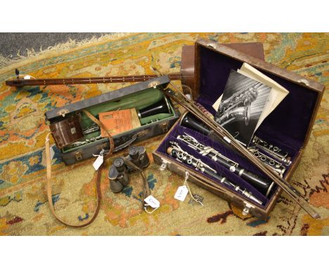 A cased pair of ebony selmer clarinets with nickel plated fittings, together with one other clarinet in a fitted case,a singl