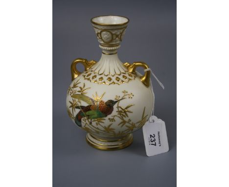 A Royal Worcester twin handled vase of baluster form, design number 1109, decorated in coloured enamels with a humming bird a