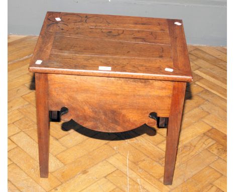 A George III field walnut commode stool, with hinged lid, ceramic liner with wood cover, shaped apron on inner chamfered squa