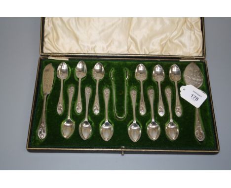 Walker and Hall, a cased set of twelve silver coffee spoons, butter knife and jam spoon, each with florally cast handle, Shef