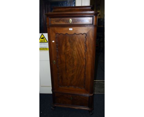 A 19th century French mahogany cupboard, the caddy top over a frieze drawer and serpentine panel door enclosing three shelves